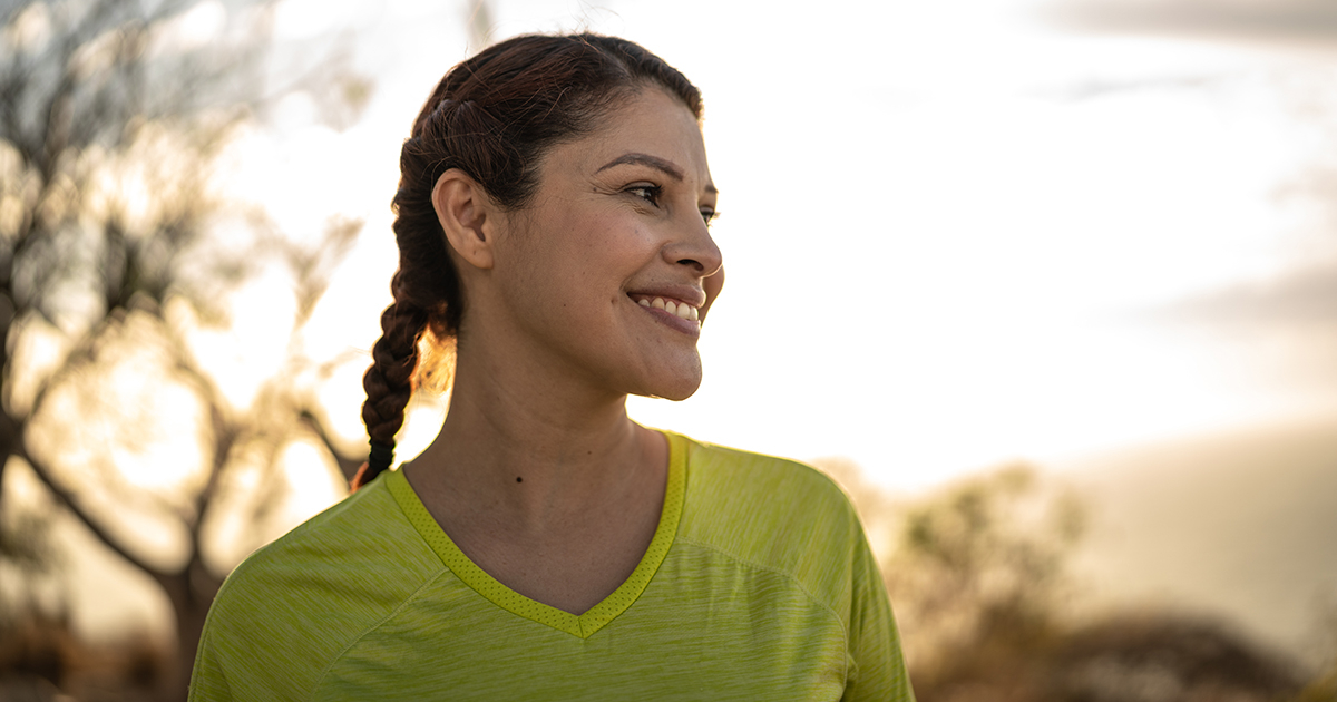 Woman in a yellow shirt smiling