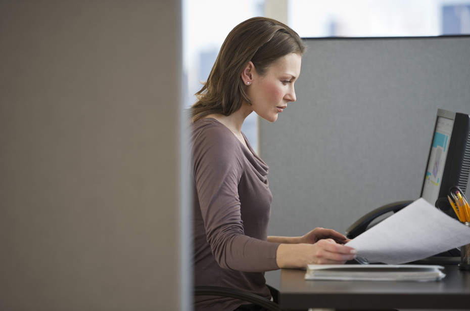 Woman working in a cubicle 