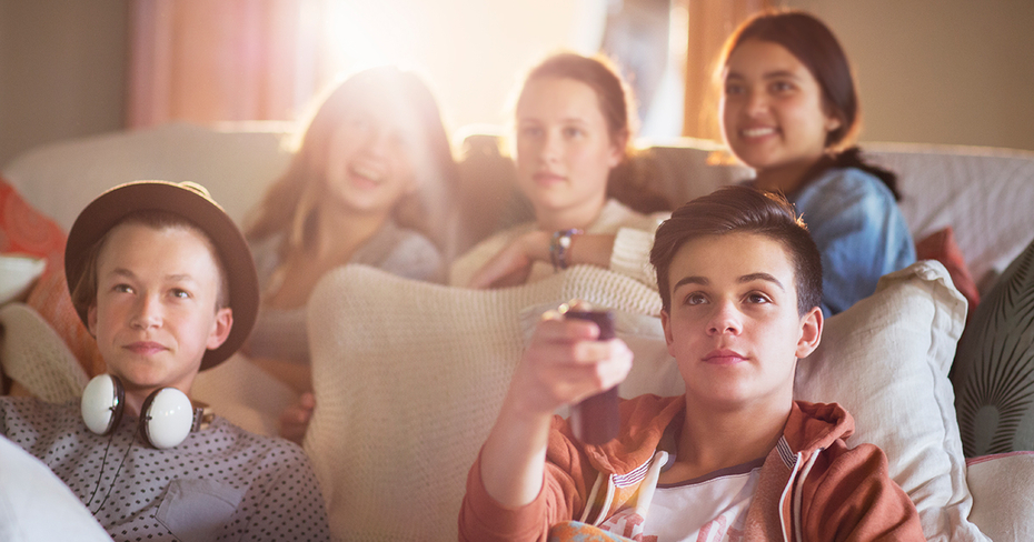 Five friends streaming a movie at home