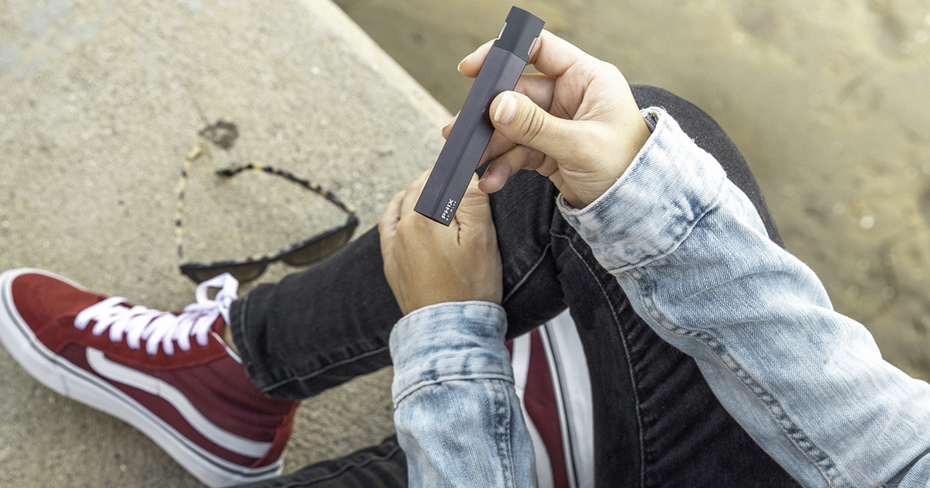Vans shoes and a vape