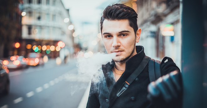 guy vaping on the street