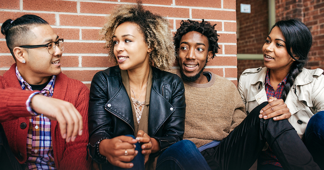Young Adults Sitting and Smiling