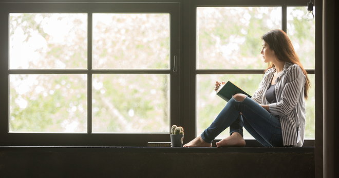 Girl looking out window