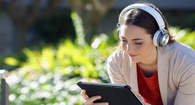 Girl using a tablet outside