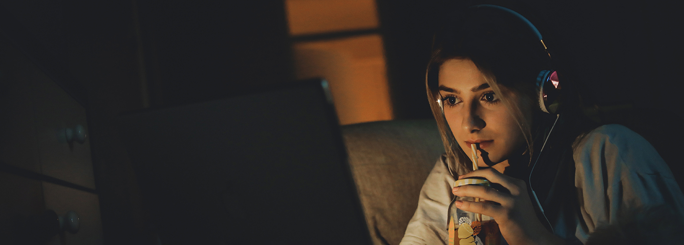 Young woman watching movie on the couch